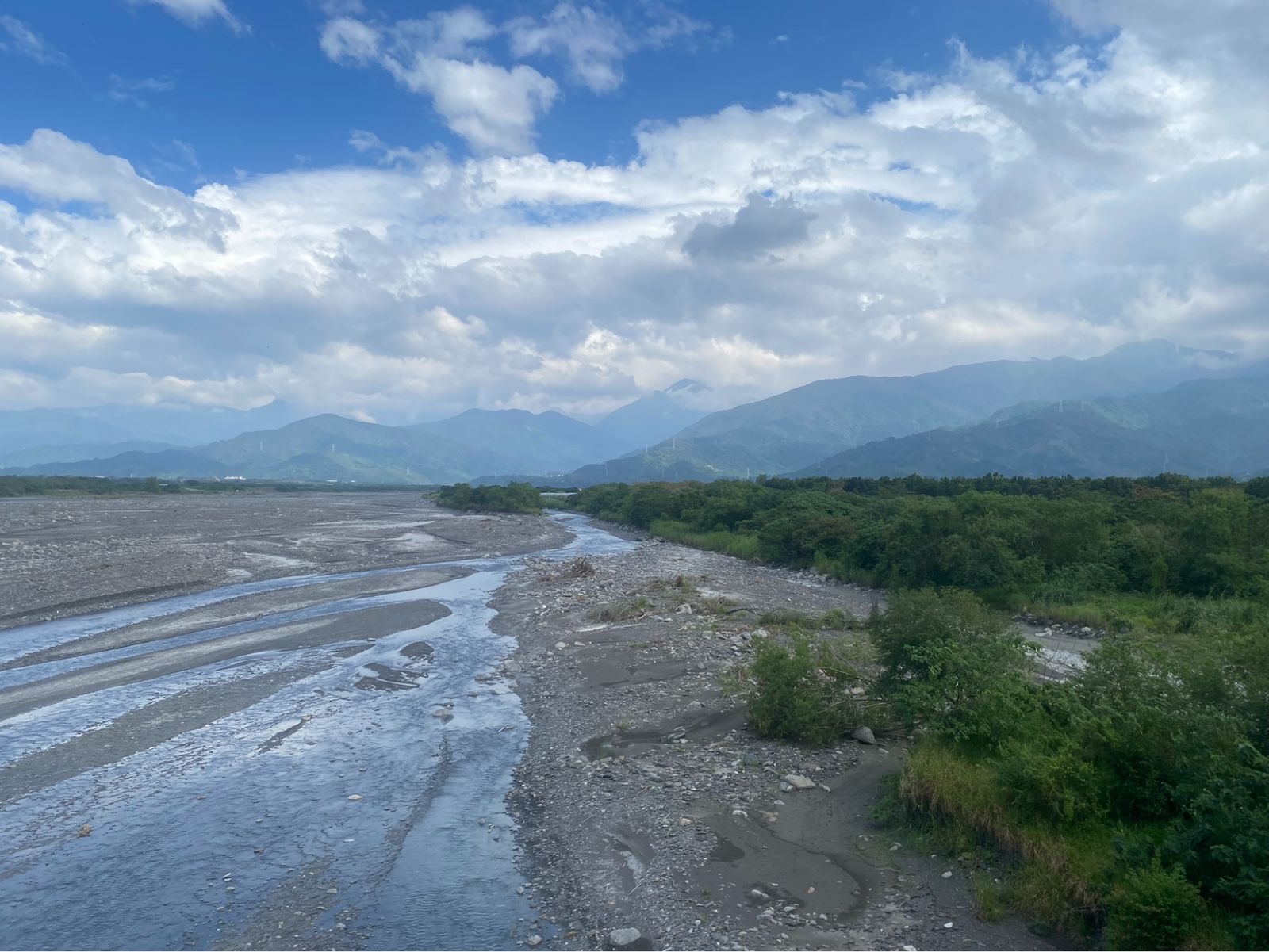 View of the mountain ridge from the plains east of Kaohsiung (left), and Huaqiao Fish Market in Donggang (right)