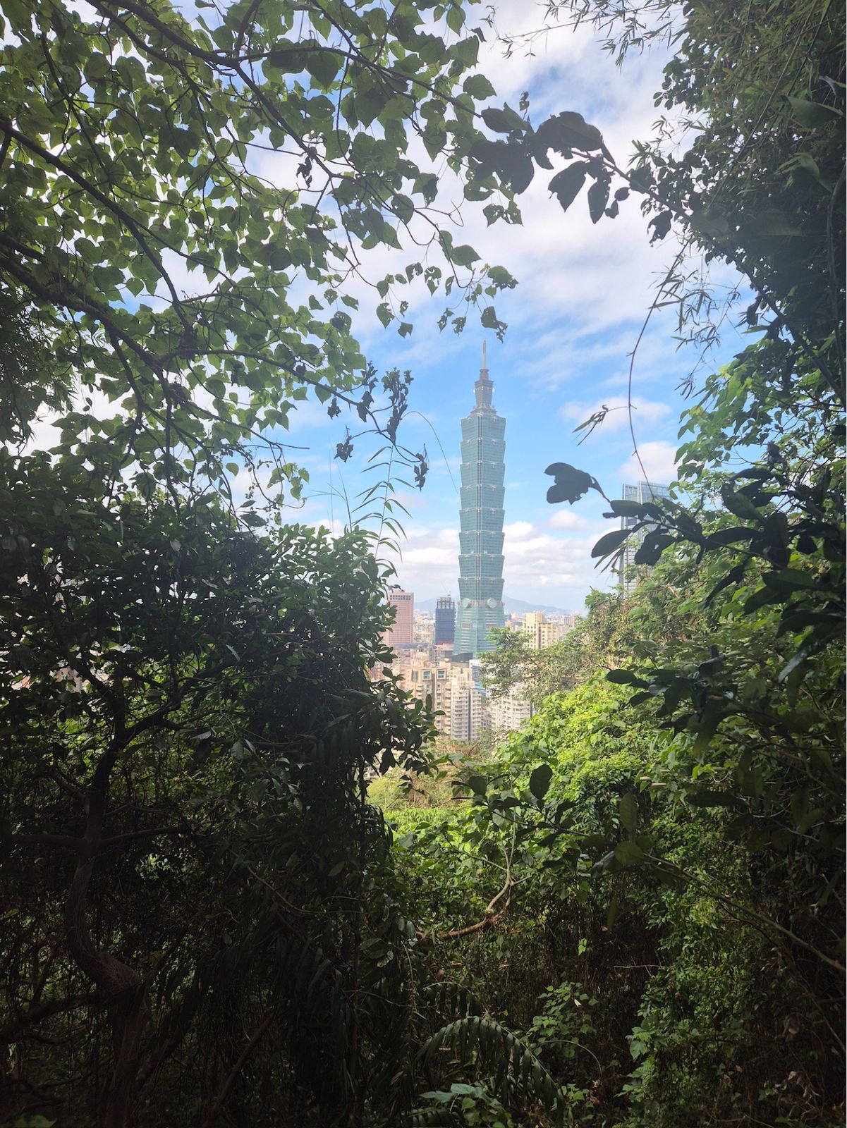Elephant Hill: peeks of Taipei 101 (left), and Buddhas at shrines along the trails (right)